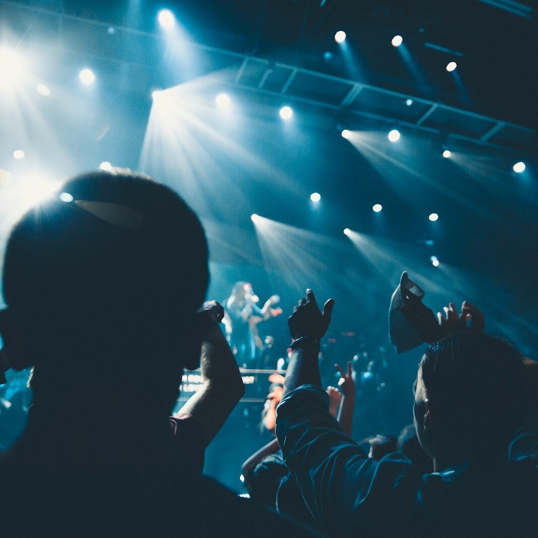 people standing in front of stage